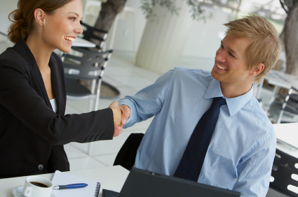 Two businesspeople shaking hands. alternate text for this image