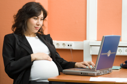 Pregnant woman at work alternate text for this image