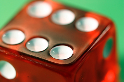 Close-up of dice with six alternate text for this image