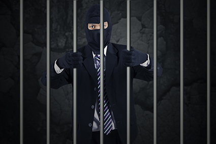 Businessman wearing a mask in jail alternate text for this image