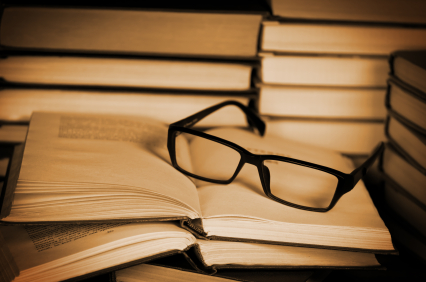 Glasses on open book. alternate text for this image