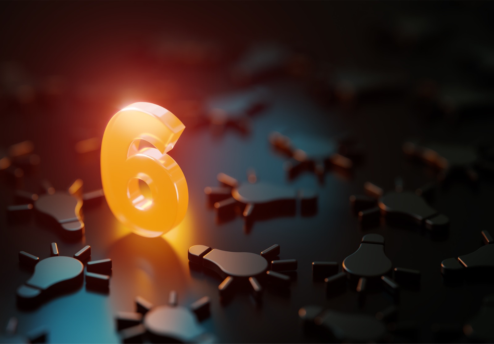 Orange numéro six brillant au milieu des symboles d’ampoule noire sur fond noir.